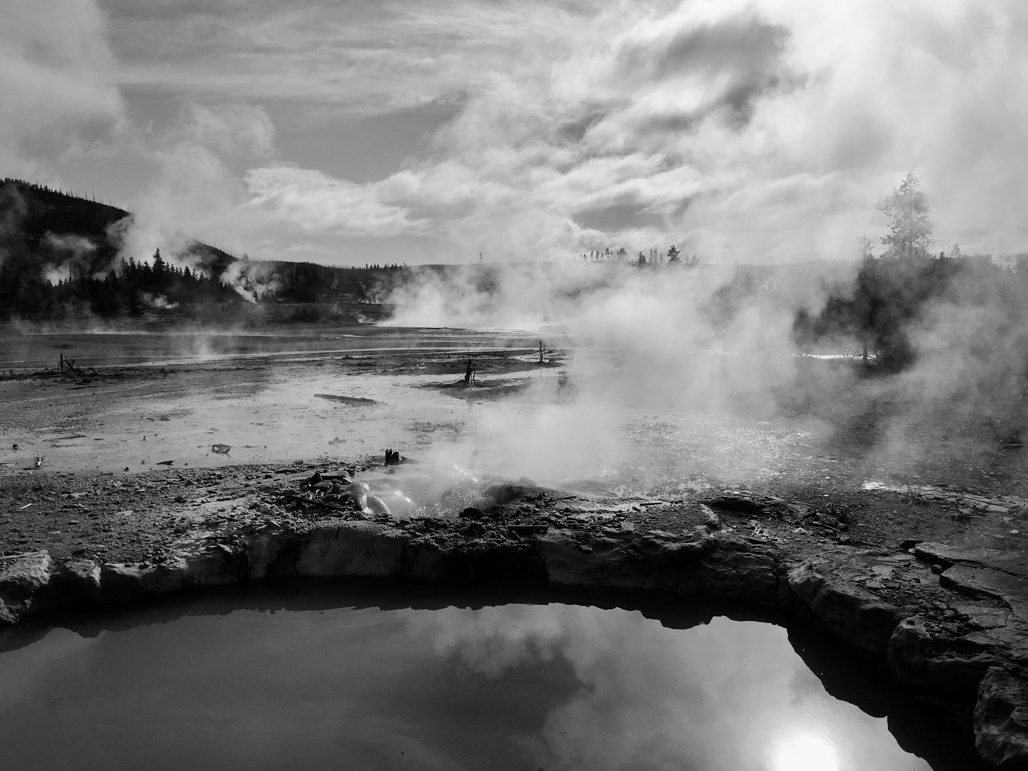Storm clouds over a river, black and white